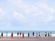 Youths Enliven Sonar Para Beach Mornings With Football and Cricket