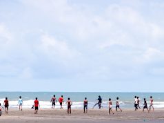 Youths Enliven Sonar Para Beach Mornings With Football and Cricket
