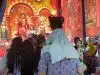 A Father’s Shoulders Offer a Child a Better View of Durga Puja
